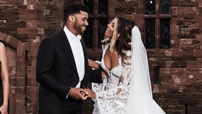 Future Zahir Wilburn with his mother, Ciara and Russell Wilson on their wedding.